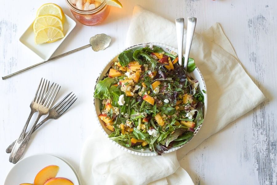 Mediterranean white bean and peach salad with fresh summer ingredients.