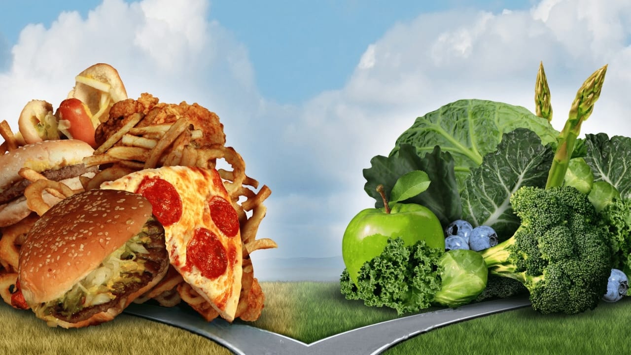 Split image comparing unhealthy fast foods like burgers, fries, pizza, and fried chicken with healthy fruits and green vegetables including broccoli, kale, cabbage, asparagus, apples, and blueberries.