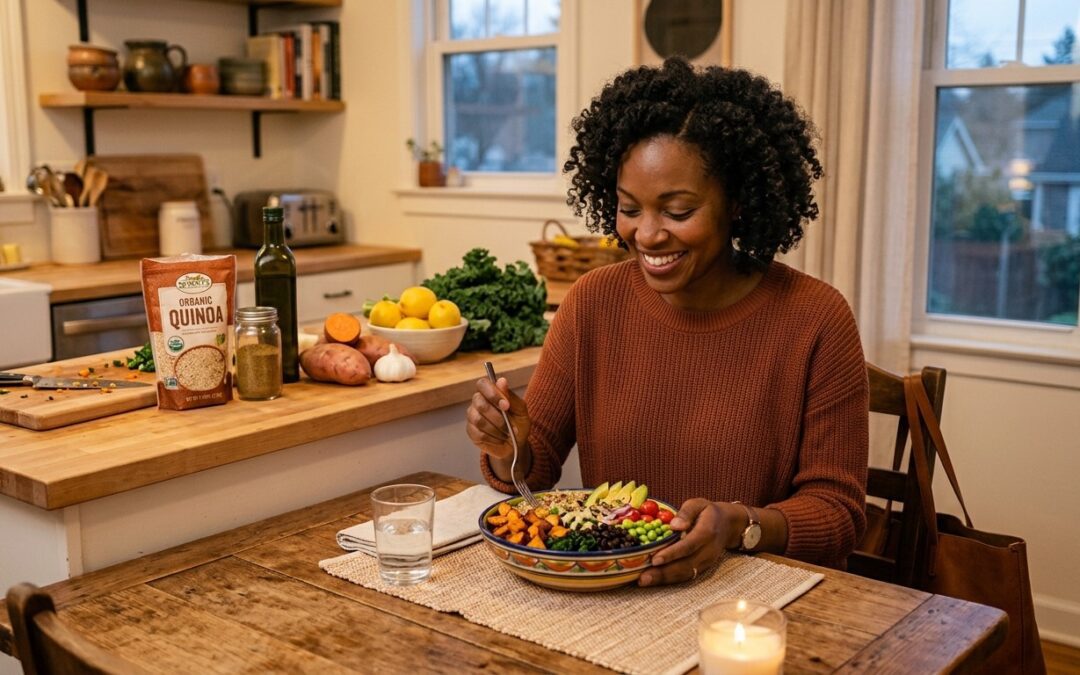 Black woman enjoying a colorful plant-based meal with quinoa, vegetables, and greens at a cozy kitchen table.